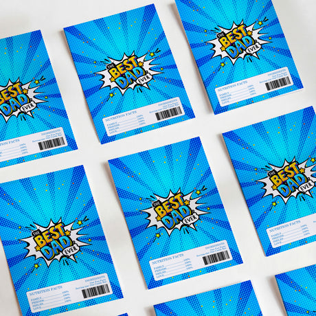 Set of blue DIY chocolate wrappers with 'Best Dad Ever' comic text and nutrition barcode