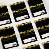 Black and gold 100th birthday chocolate wrappers with star speckles and "100" text