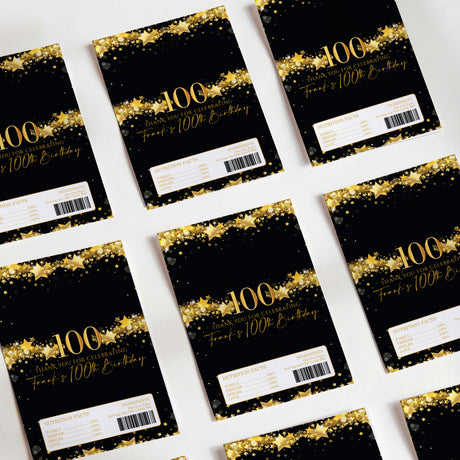 Black and gold 100th birthday chocolate wrappers with star speckles and "100" text