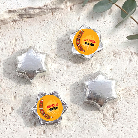 Foil-covered chocolate star chocolates, silver, with NAIDOC Week stickers
