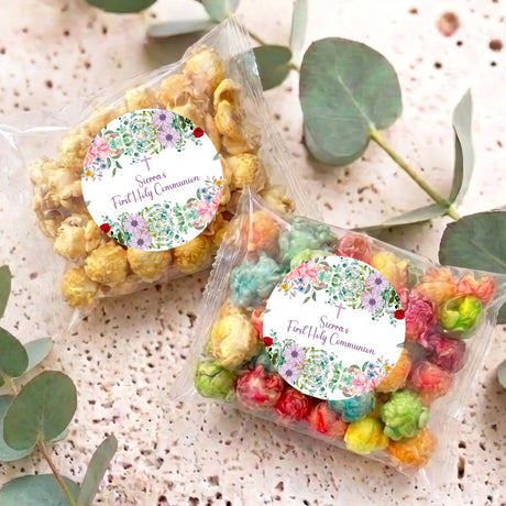 Pair of personalised popcorn bags with floral round labels and clear crinkled tops