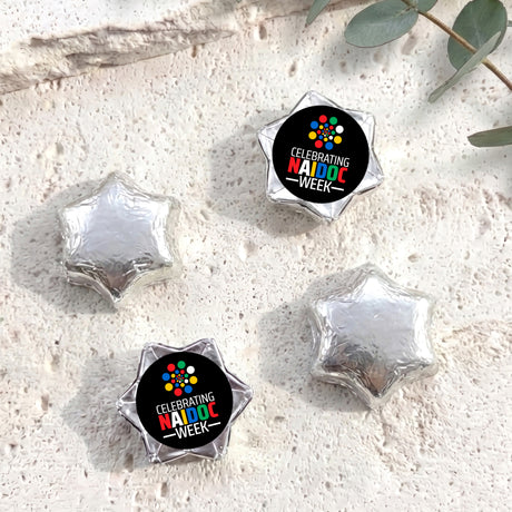 Foil-covered chocolate stars with Naidoc Week label, silver foil