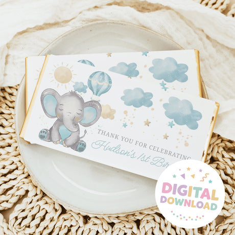 Chocolate bar wrapper with gray elephant, blue clouds, sun and “Hudson’s 1st Birthday” text
