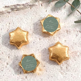 Foil-covered chocolate stars, gold with round personalized label