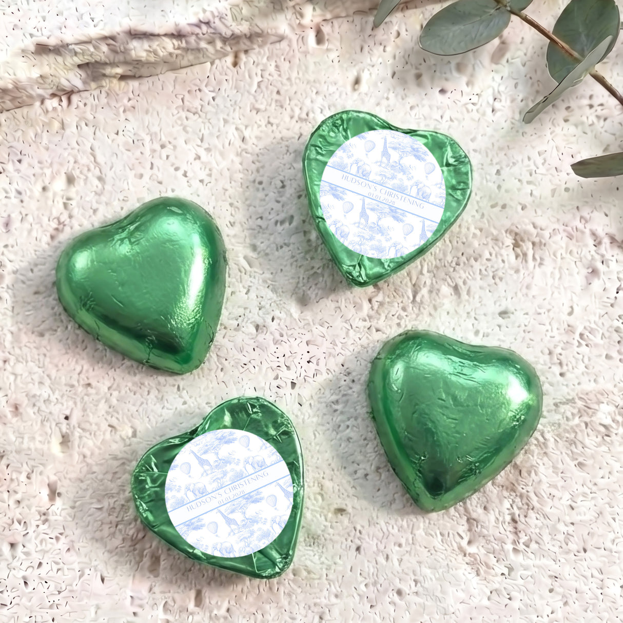 Green foil-covered chocolate hearts with heart-shaped foil wrap and white label