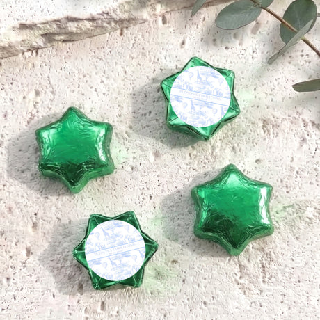 Personalized foil-covered chocolate stars in green, with round label center.