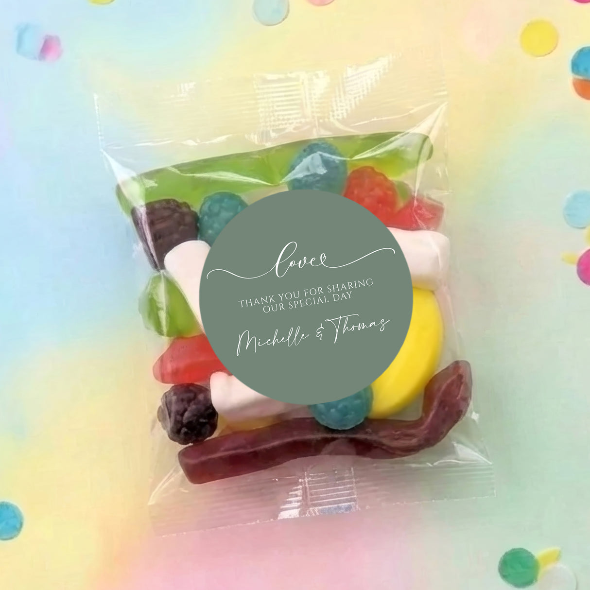 Personalised lolly bag with colorful sweets and green 'Love' thank-you label.
