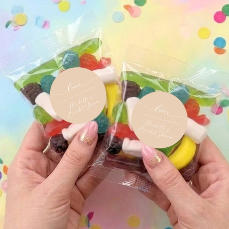 Set of two beige bridal shower lolly bags in clear plastic with round Love labels
