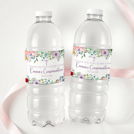 Printed bottle labels on two clear soda bottles with wildflower band and red accents