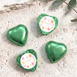 Green foil heart chocolates with round label reading AUDREY