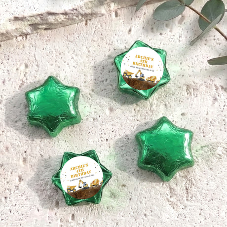 Foil-covered chocolate star sweets in green, with birthday foil label