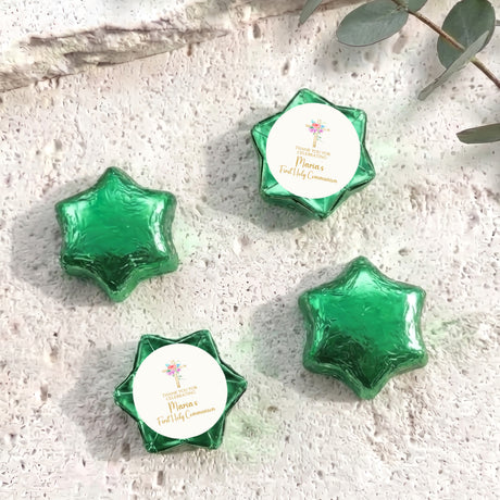 Green foil star chocolates with round personalized First Holy Communion gift label