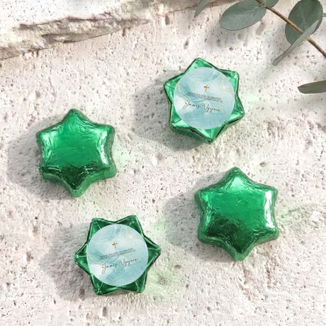 Green foil star chocolates with cross label, set of four foil-wrapped stars