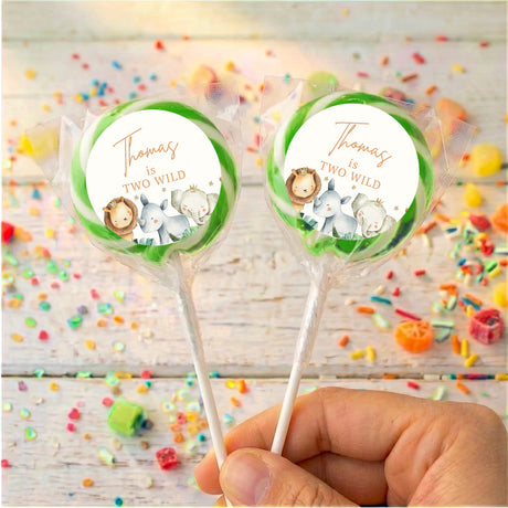Personalised watercolor baby animal lollipops with Thomas text, green-edged round wrappers