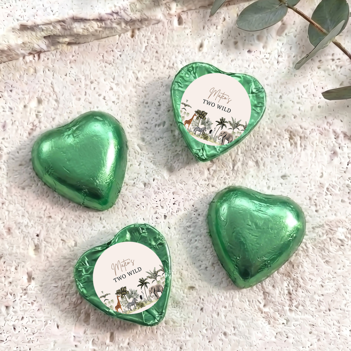 Green foil chocolate hearts with round personalised label reading “Two Wild”