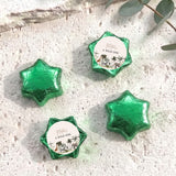 Green foil-covered star chocolates with round "A Wild One" label