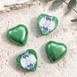 Foil-covered chocolate hearts in green foil with printed thank-you label