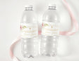 Personalised water bottle labels with blush rose gold frame, on clear plastic bottles
