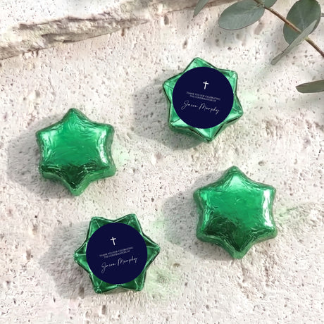 Green foil star chocolates with dark blue round label featuring cross and message