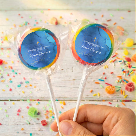 Blue christening lollipops with gold cross in clear wrap, rainbow edge on labels