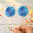 Blue christening lollipops with gold cross, clear wrapper, held on white sticks