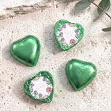 Green foil heart chocolates with 'Dolly is Four' dinosaur birthday print
