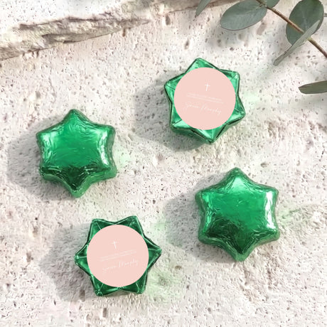 Green foil chocolate stars with cross emblem and personalised round label
