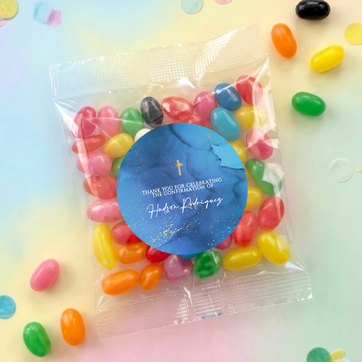 Personalised jelly bean bag with blue round sticker and gold cross emblem
