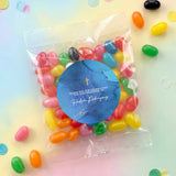 Personalised jelly bean bag with blue round sticker and gold cross emblem