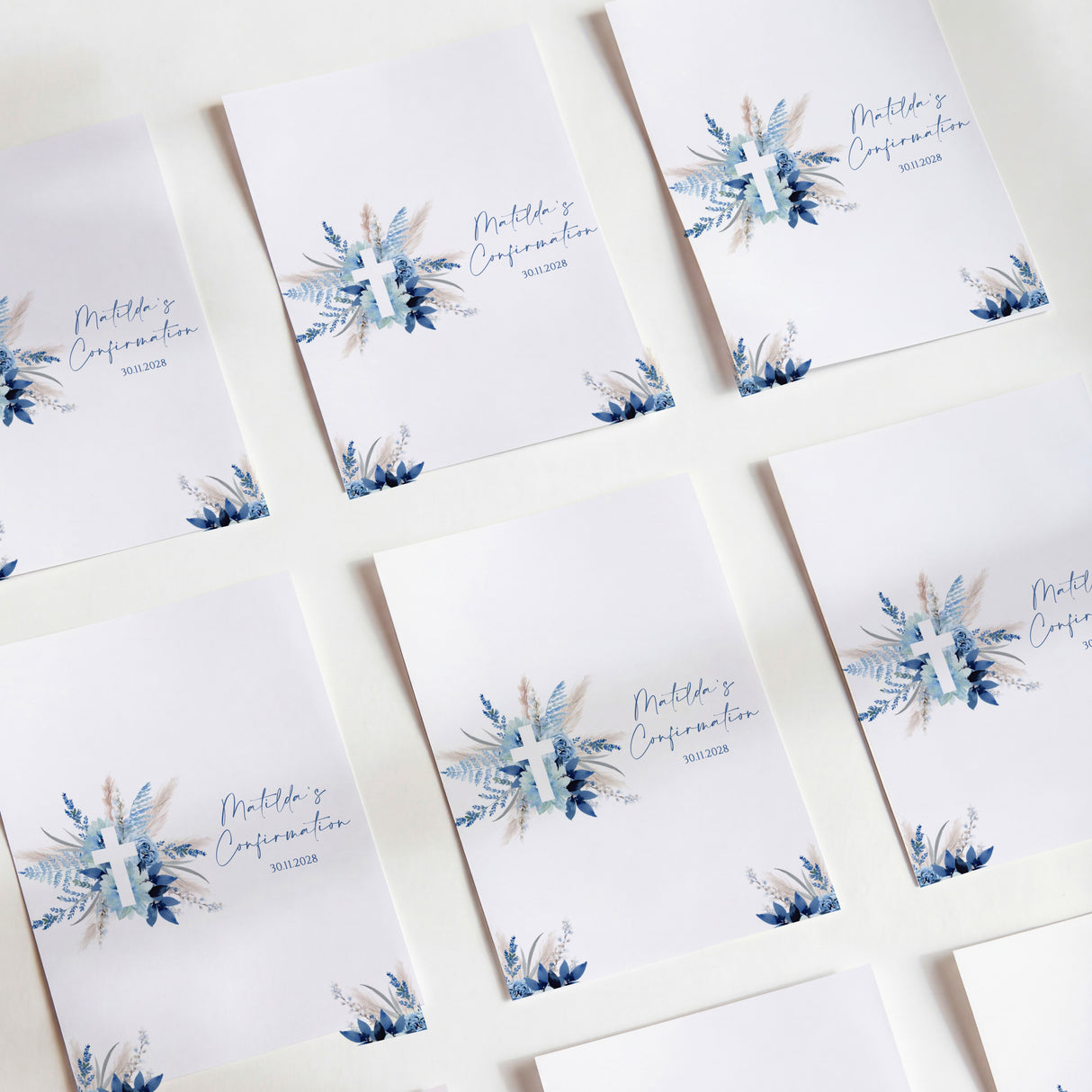 Printed chocolate wrappers, white with blue pampas flowers and cross design