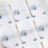 Printed chocolate wrappers, white with blue pampas flowers and cross design