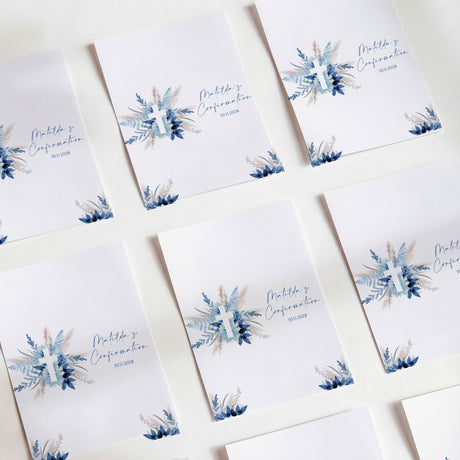 Printed chocolate wrappers, white with blue pampas flowers and cross design