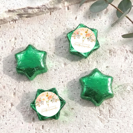 Foil-covered star chocolates with green foil and a white floral name label