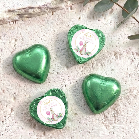 Green foil-covered chocolate hearts with personalised first birthday bunny label