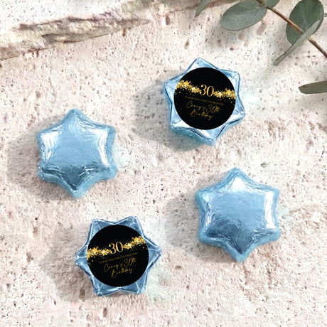 Blue foil-covered chocolate stars with black 30th birthday label and gold '30' text