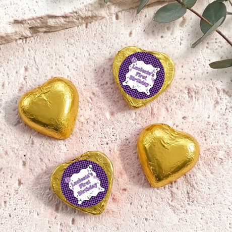 Gold foil-covered chocolate hearts with purple check birthday label