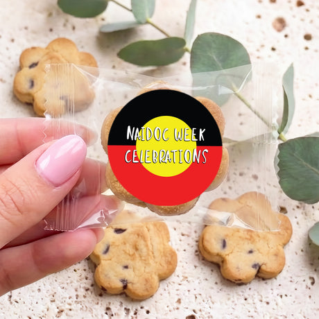 Personalised bite-size chocolate chip cookies with circular Naidoc Week Celebrations label