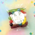 Assorted candy lolly bag with clear cellophane and white eucalyptus thank-you label