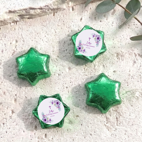 Green foil chocolate stars with floral cross Communion label on a round centre card
