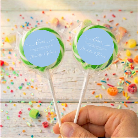 Personalised baby blue wedding lollipops with round love message labels, green rim