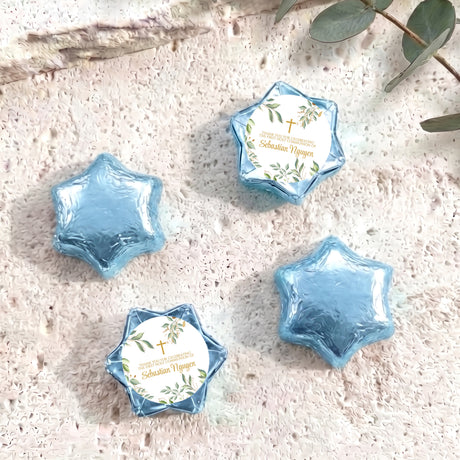 Eucalyptus foil-covered star chocolates, light blue foil star packs with round label and cross
