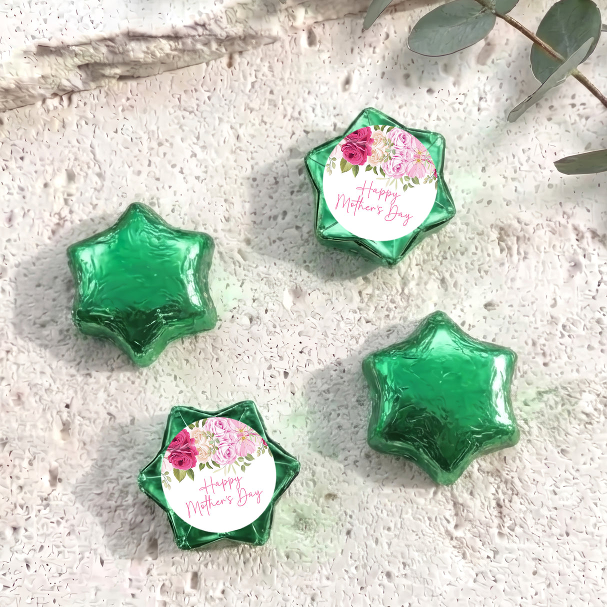 Foil-covered green chocolate stars, one with floral 'Happy Mother's Day' label