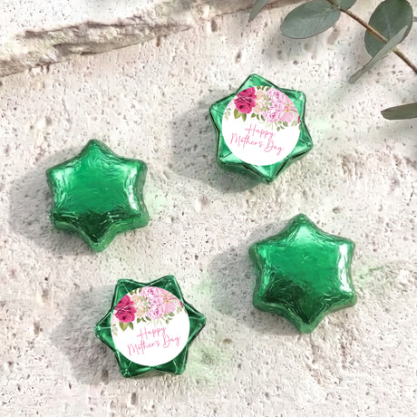 Foil-covered green chocolate stars, one with floral 'Happy Mother's Day' label