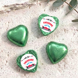 Foil-covered chocolate hearts, green foil with white Theodore label