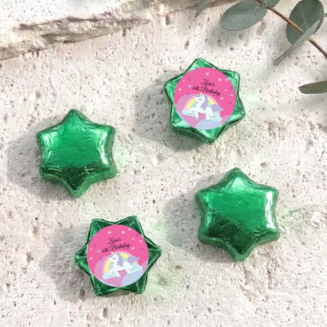 Green star-shaped foil chocolate with “Zara’s 6th Birthday” unicorn rainbow label