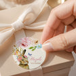 Round printed first birthday label with floral bunny, 'Hazel's First Birthday'.