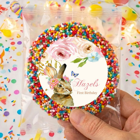 Personalised first birthday freckles featuring floral bunny circle label, 'Hazel's' and 'First Birthday' text