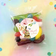 Personalised birthday party mix lolly bag with bunny floral label and multicolor sweets