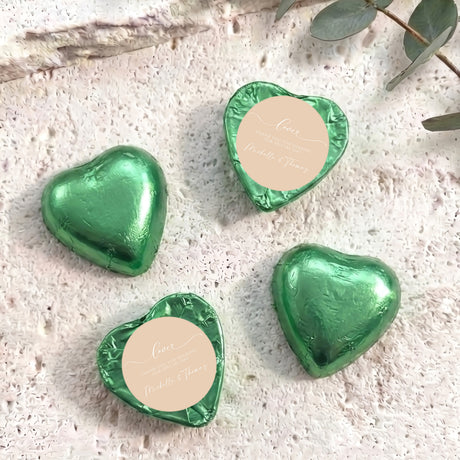 Foil-covered chocolate hearts, green, with round personalised message label