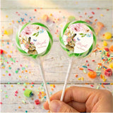 Personalised bunny floral lollipops with green-bordered round labels, held in hand